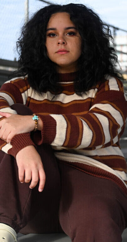 Fairmont State University sophomore Cheyenne Baker, 21, at Palatine Park on Nov. 14 2025. Baker experienced homelessness before reaching higher education.